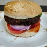 Crispy aloo tikki burger with fresh vegetables homemade recipe