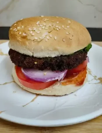 Crispy aloo tikki burger with fresh vegetables homemade recipe