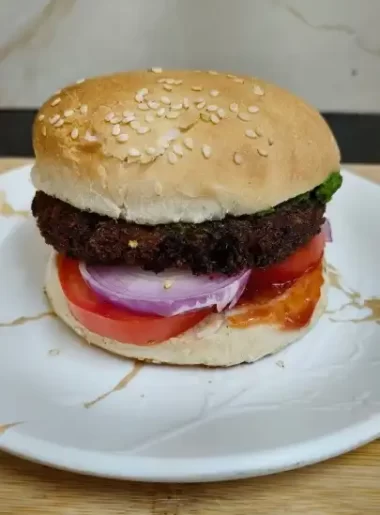 Crispy aloo tikki burger with fresh vegetables homemade recipe