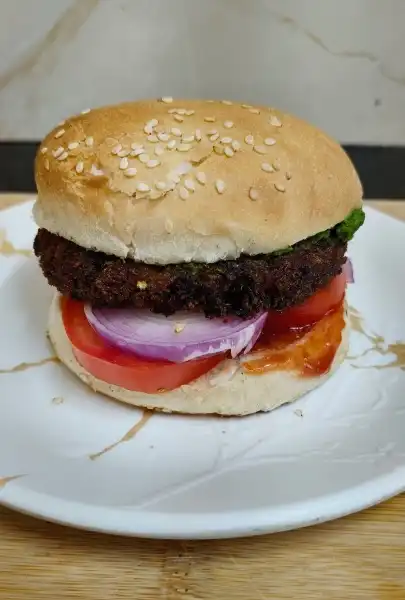 Crispy aloo tikki burger with fresh vegetables homemade recipe
